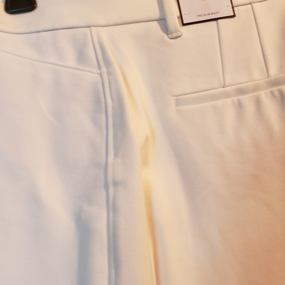 White House Black Market ivory boot cut slacks size 8